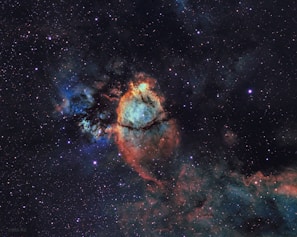 A close-up of a colorful nebula captured through a telescope during a science experiment