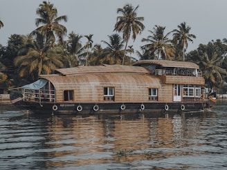 a house boat is floating on the water