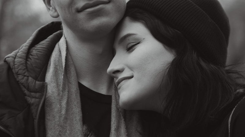 a man and a woman are embracing each other