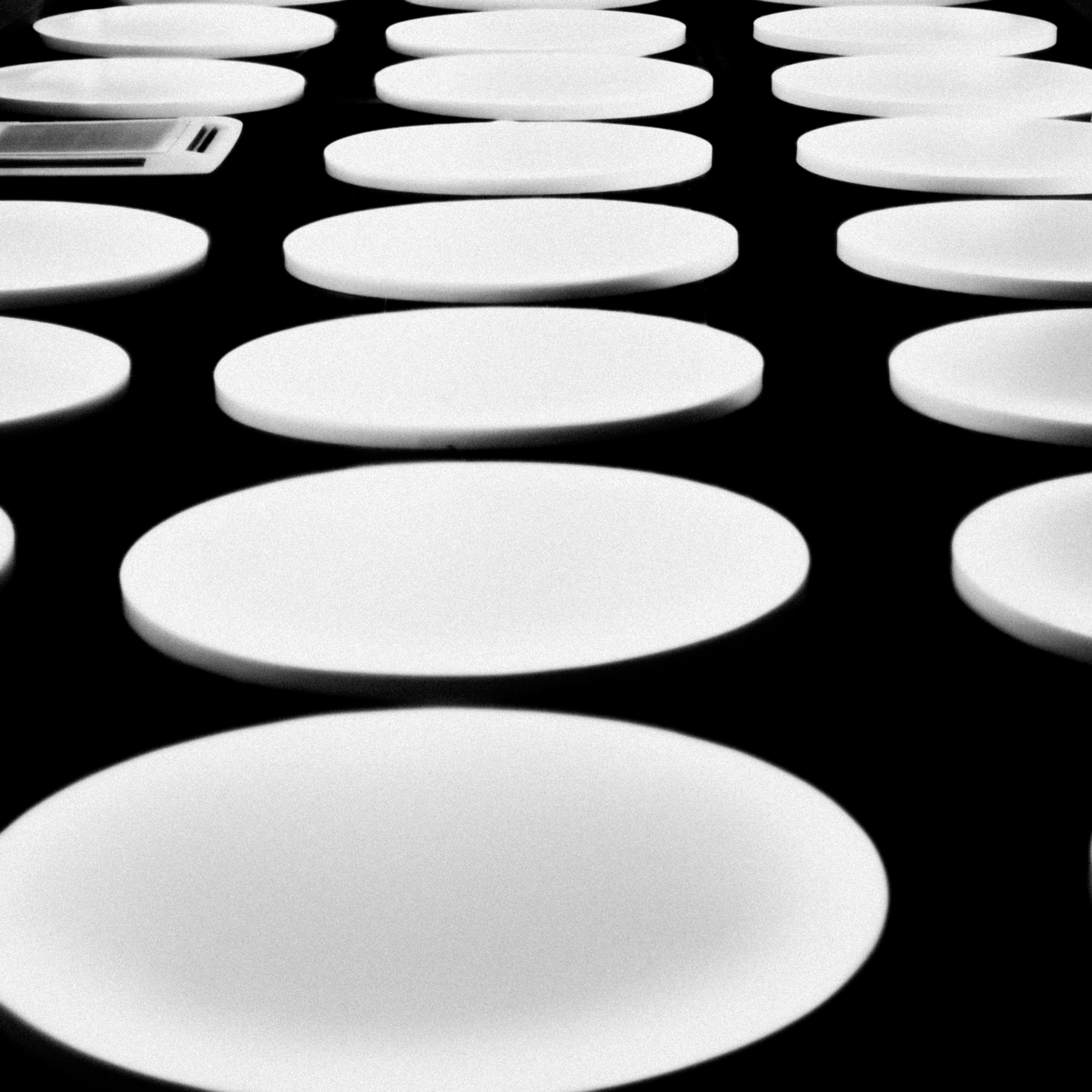 A table topped with lots of white plates photo Free Dish Image on