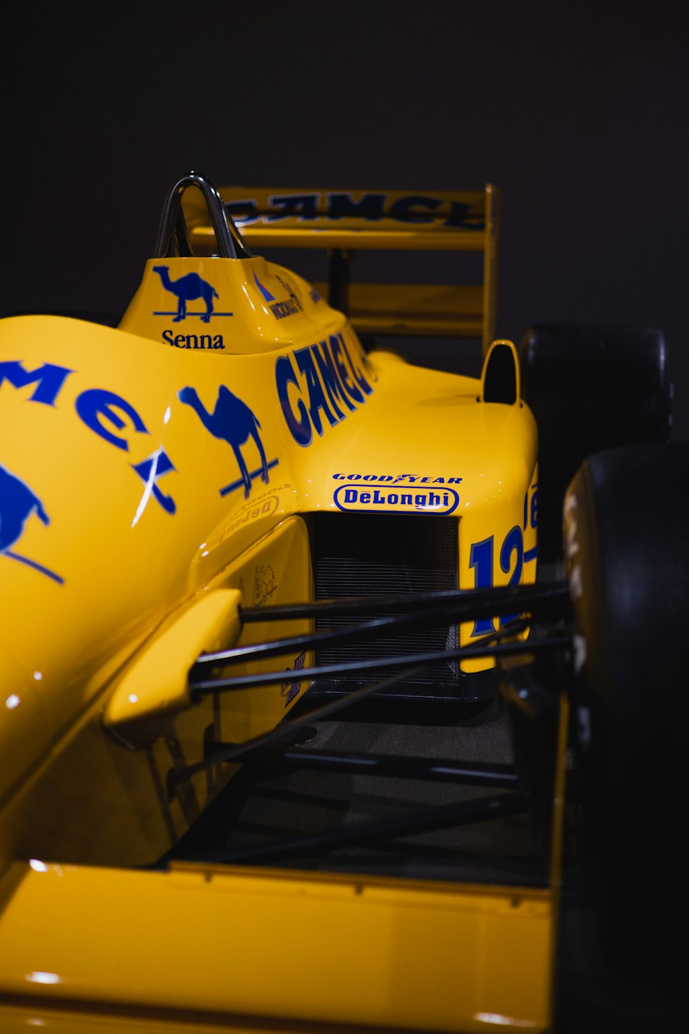 a close up of a yellow race car