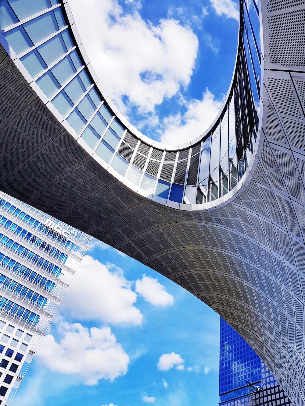 a very tall building with a sky background