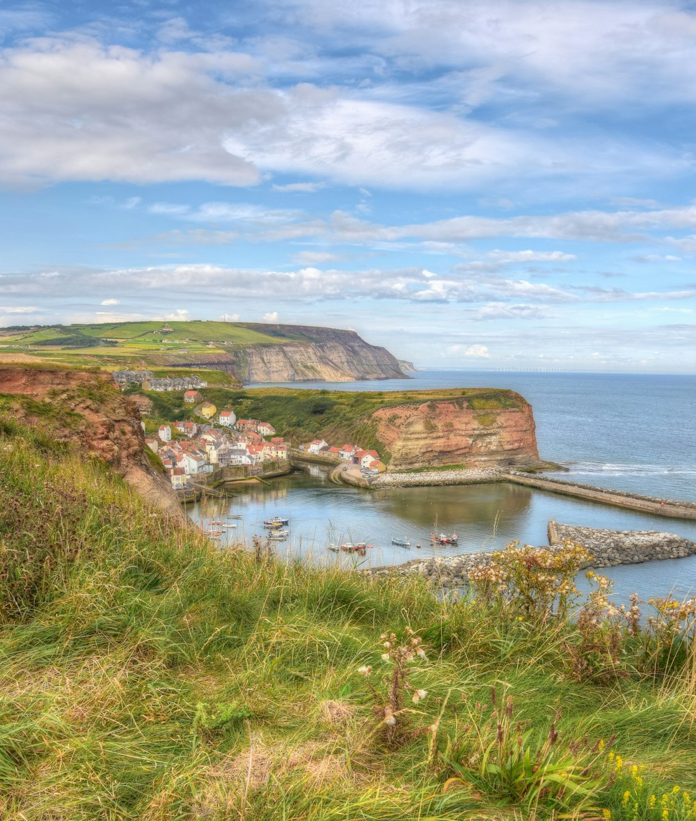 a scenic view of a small village on the coast