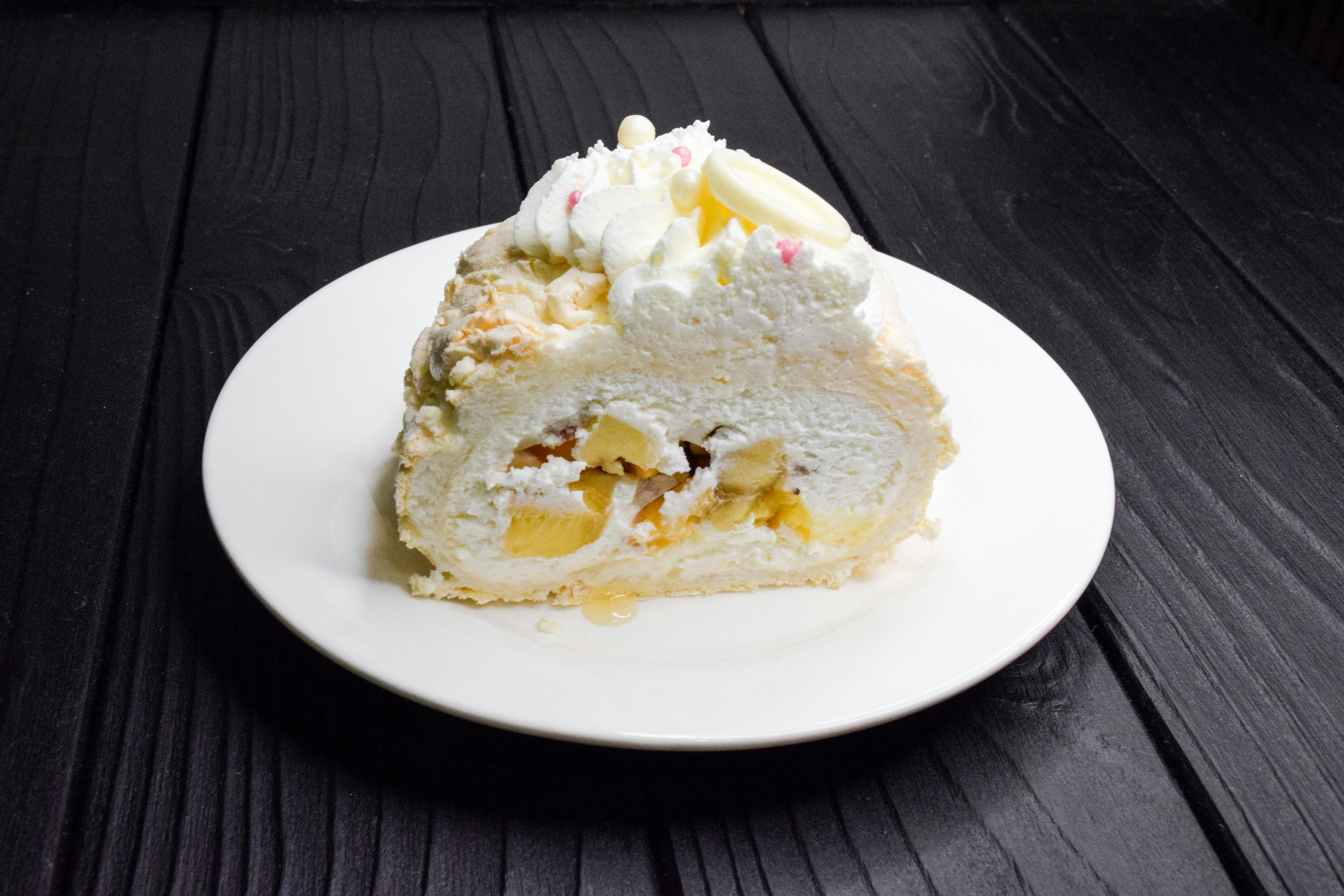 meringue roll on a black desk