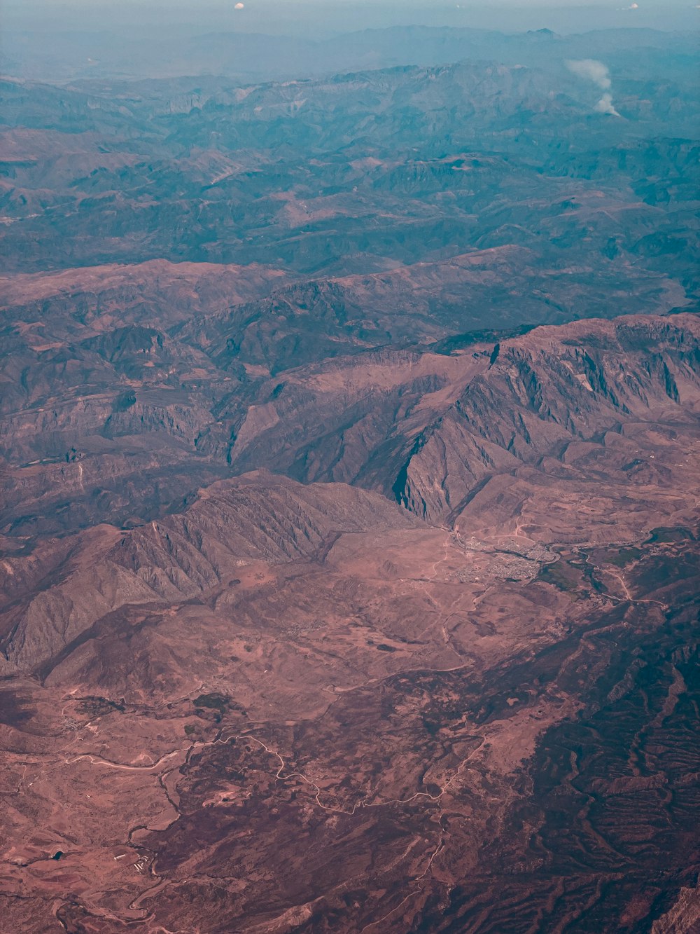 a view of a mountain range from an airplane