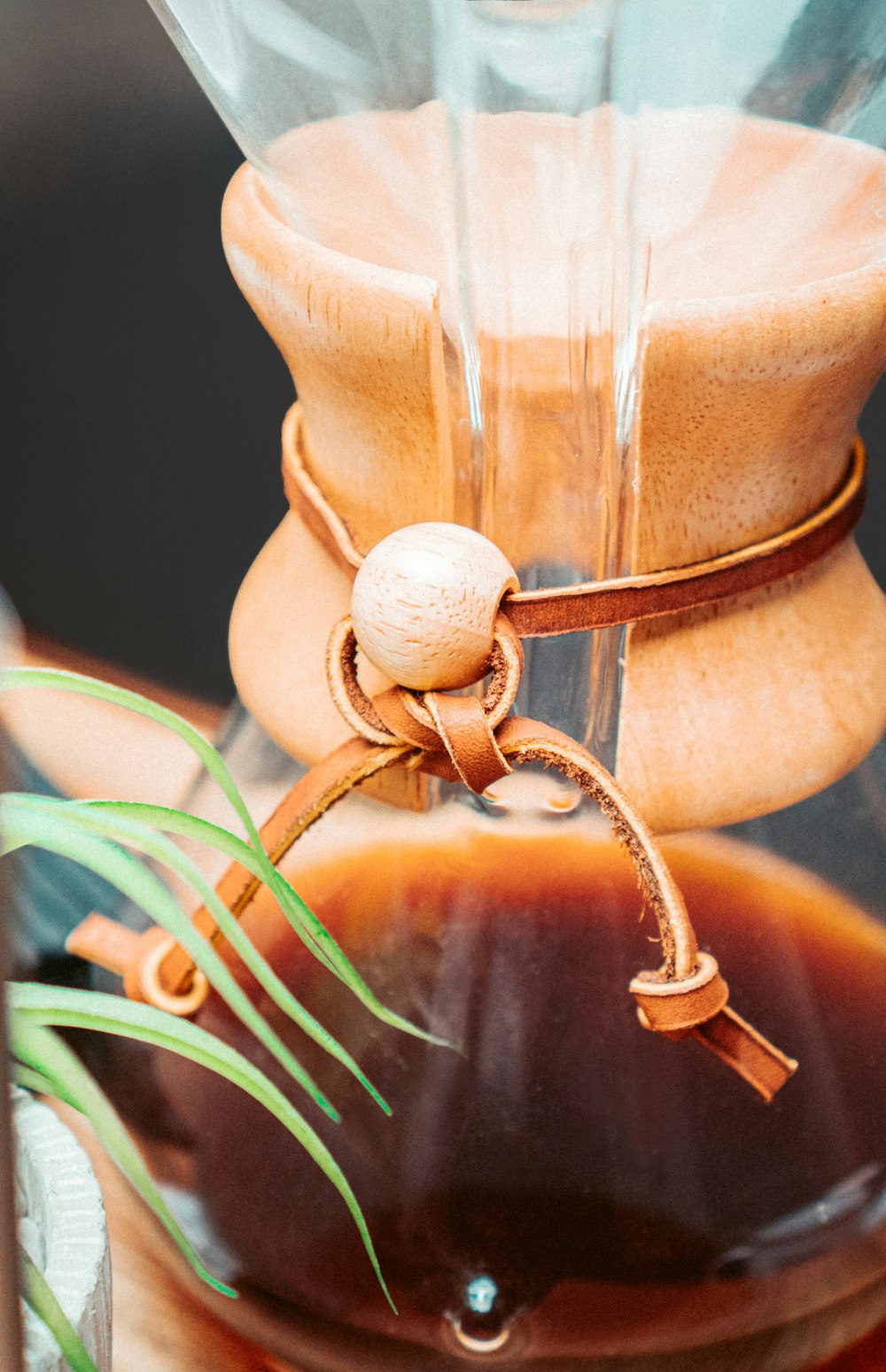 a close up of a coffee pot on a table