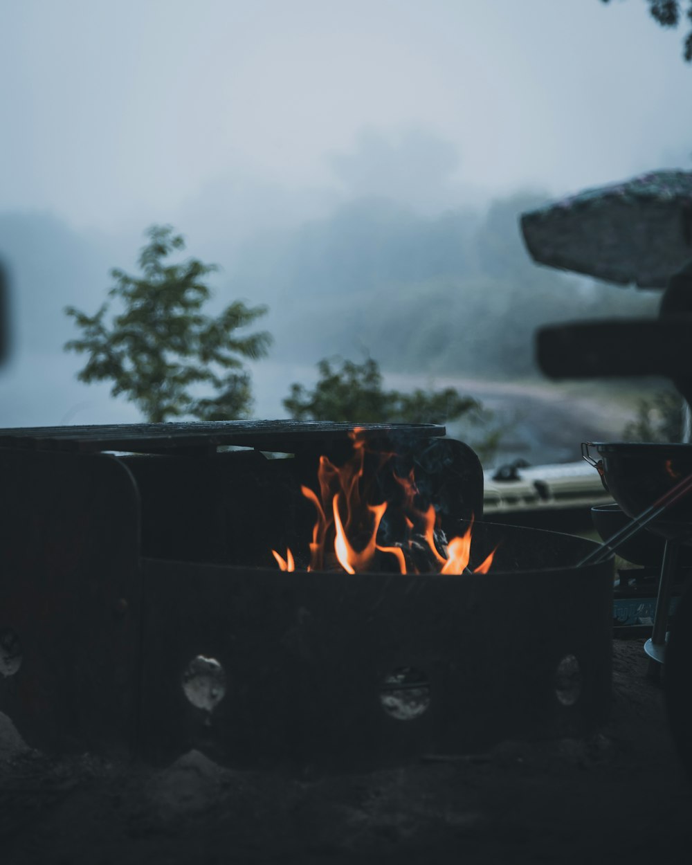 a fire burning in the middle of a forest