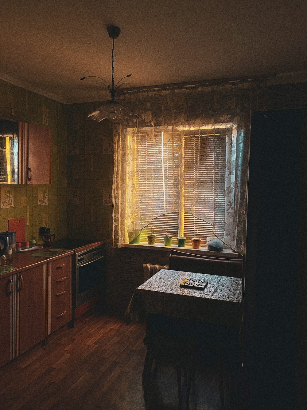 a kitchen with a table a sink and a window