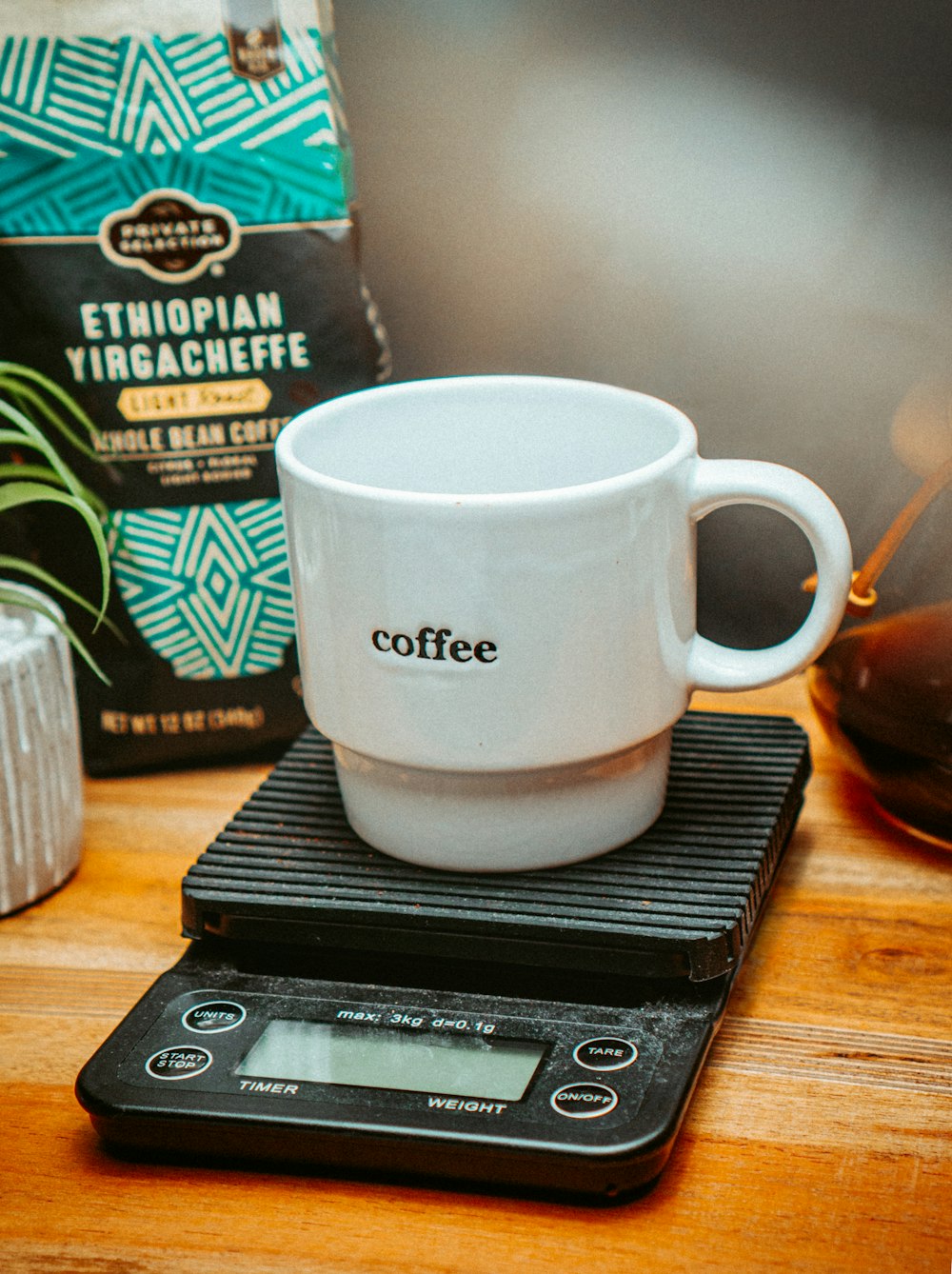 a coffee cup sitting on top of a scale