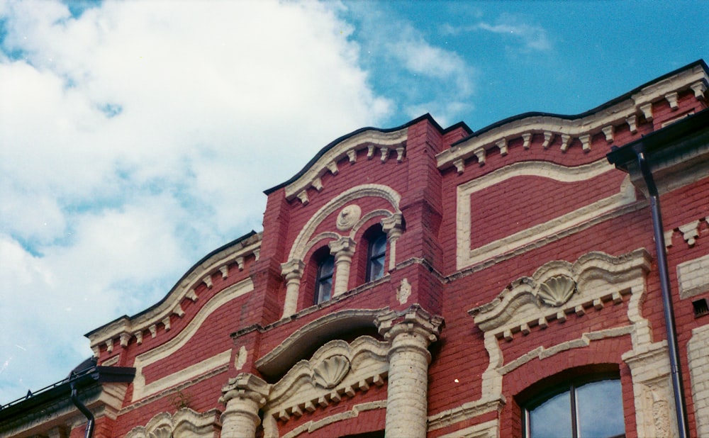 a red brick building with a clock on the front of it