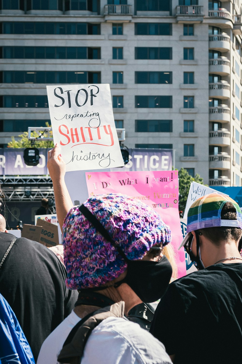 a group of people holding signs in the street