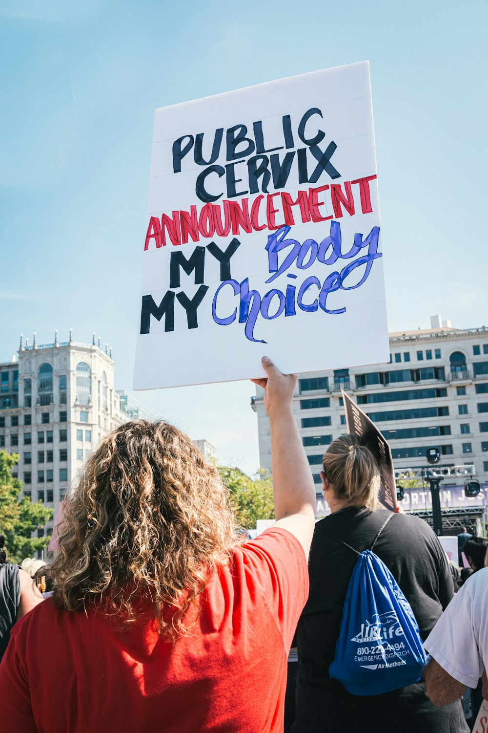 a group of people holding up a sign