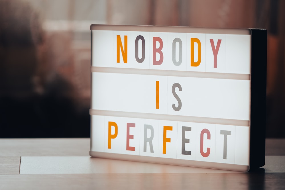 a light box that says nobody is perfect