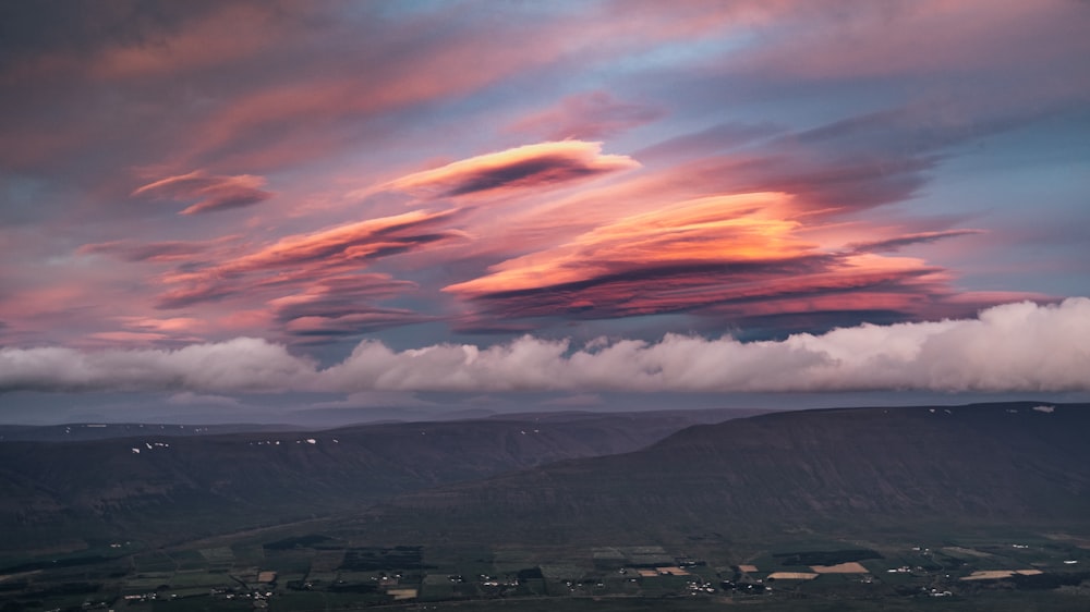 a very colorful sky with some clouds in the sky