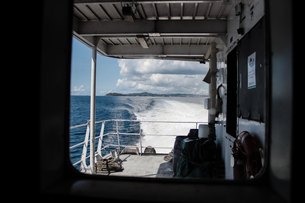 a view of the ocean from the back of a boat