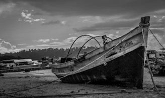 Somerled’s darkroom print of an old wooden boat resting quietly on a foggy shore