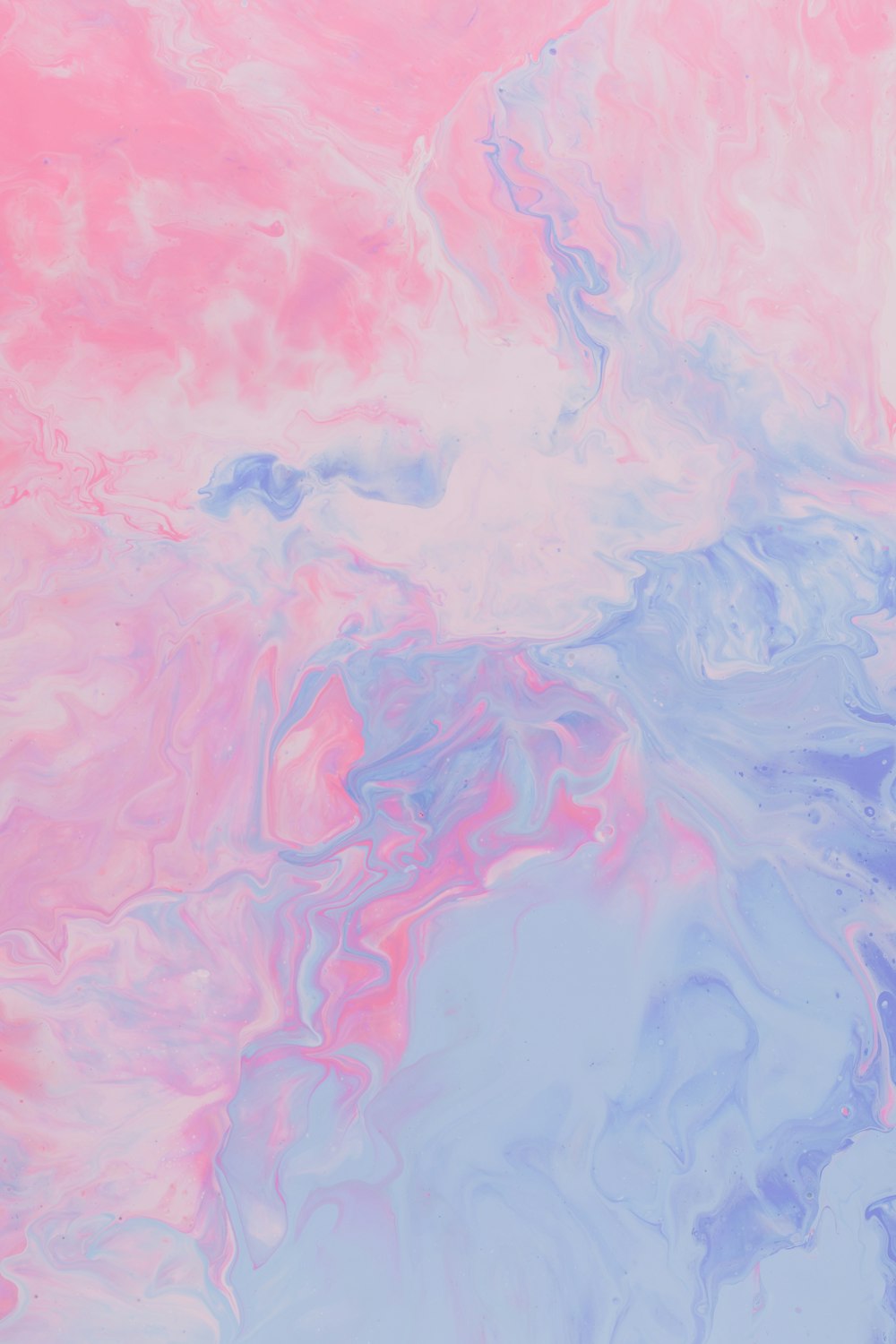a pink and blue painting with a white background