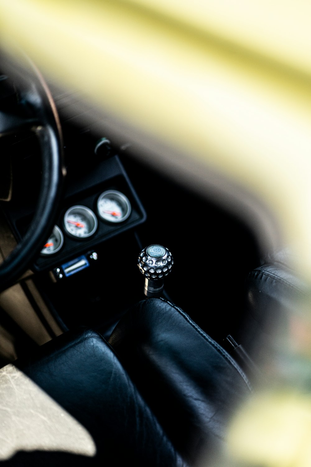 a close up of a steering wheel and dashboard of a car