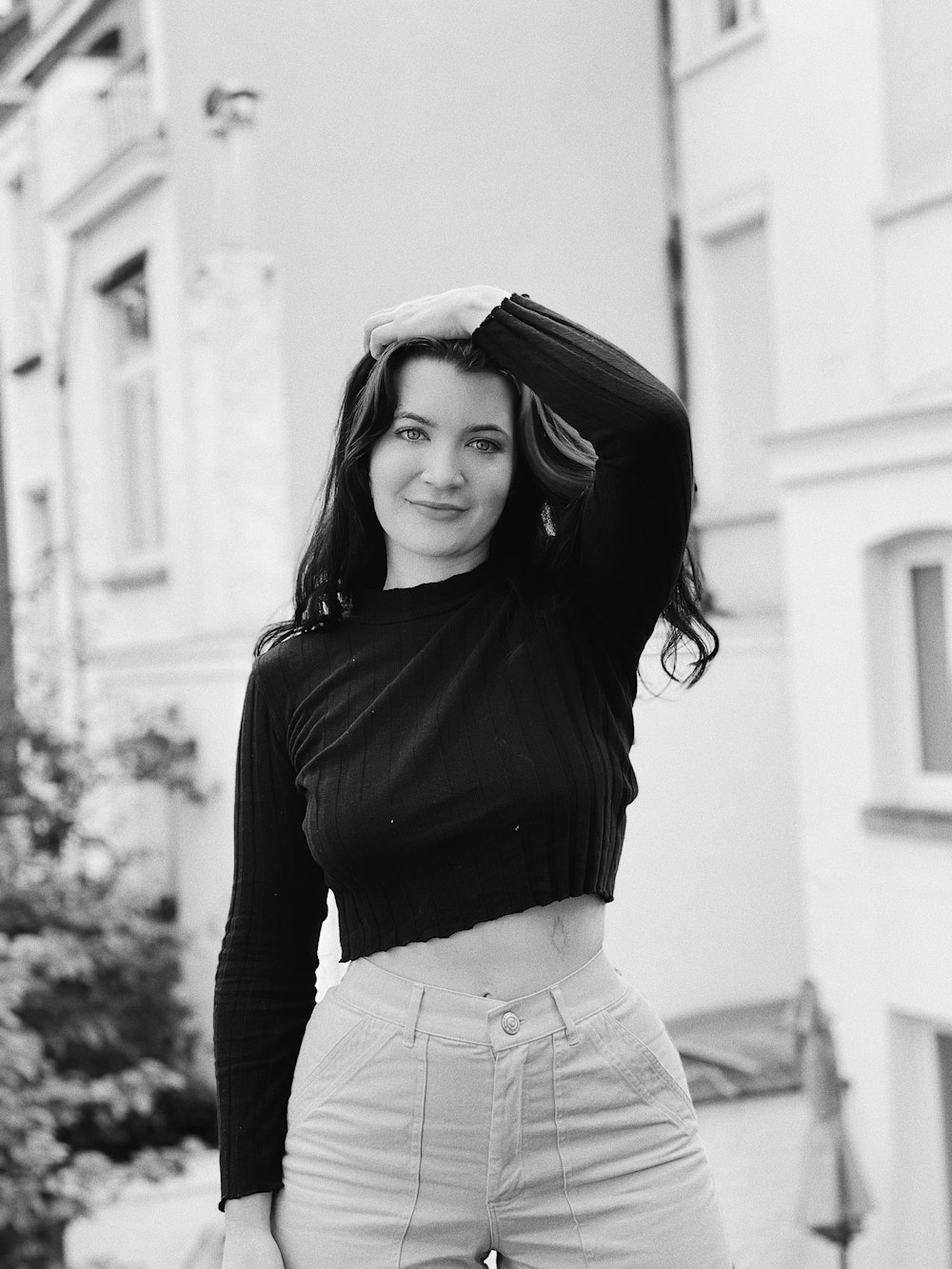 a black and white photo of a woman posing for a picture