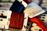several spools of thread sitting on top of each other