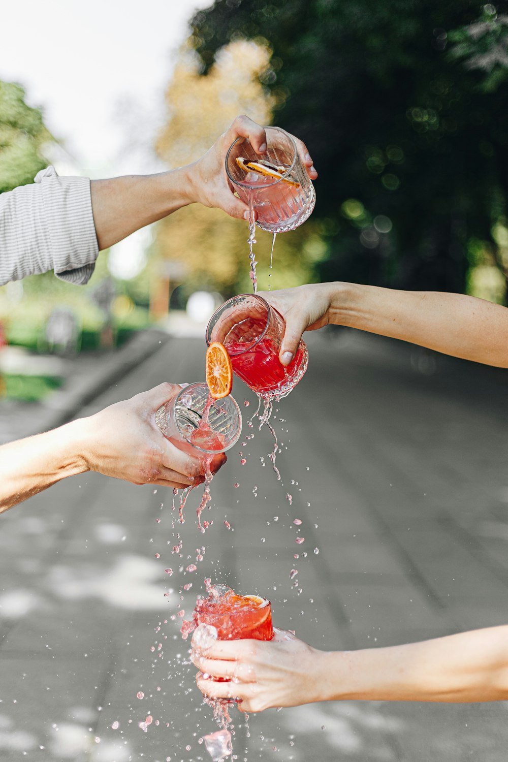 a hand holding a plastic water bottle