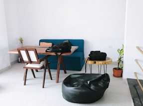 a living room filled with furniture and a blue couch