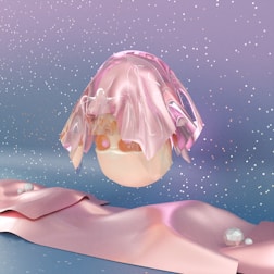 a pink object is floating in the air