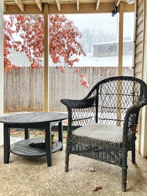 A cozy outdoor scene with the foldable chair and a small side table.