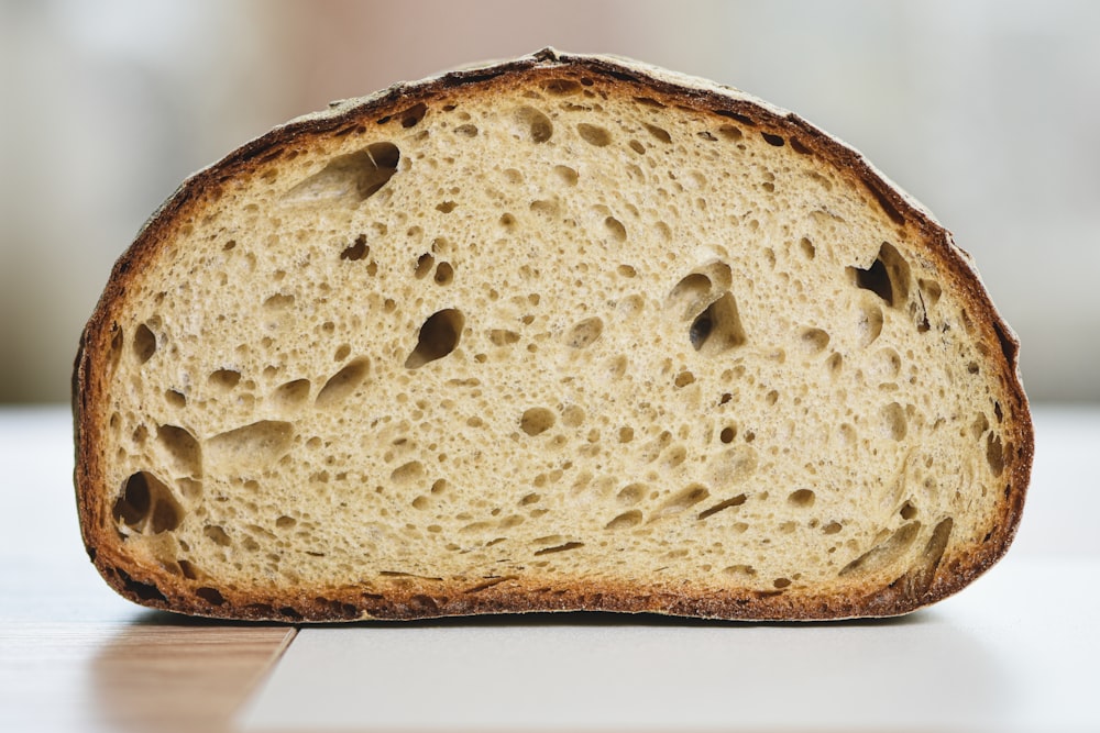 a close up of a piece of bread on a table