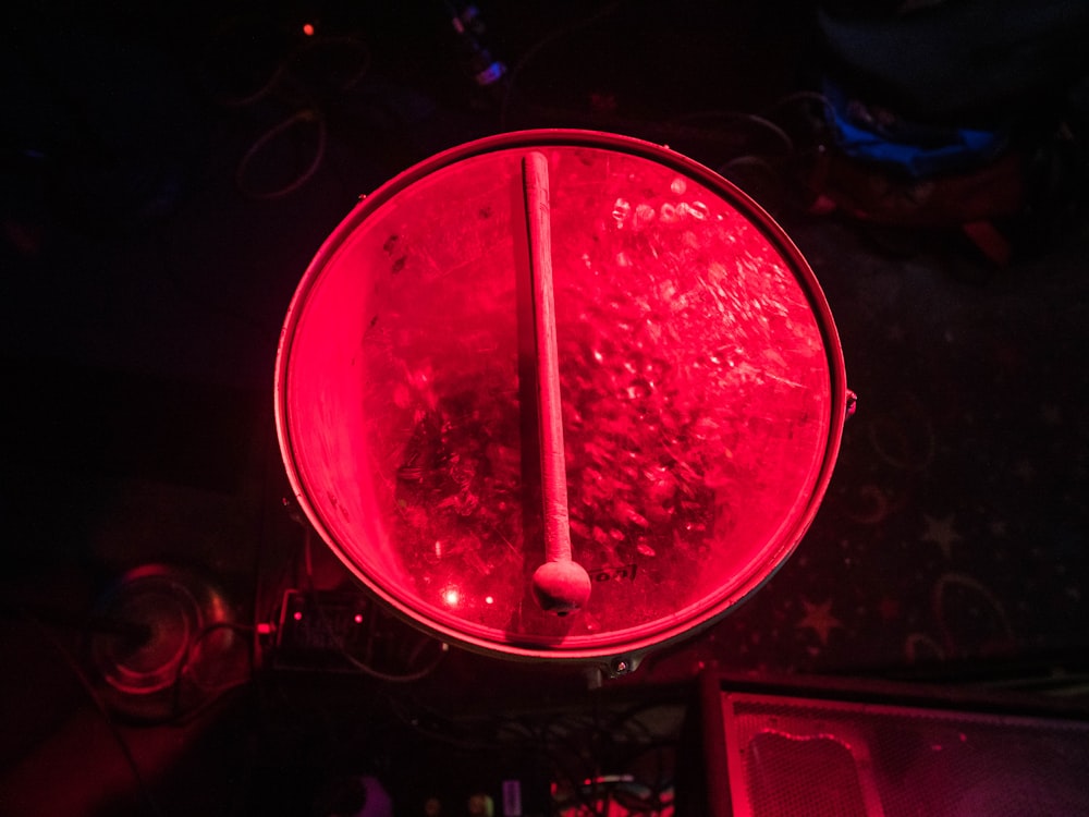 a close up of a red light in a room