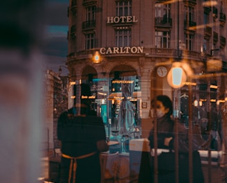 a reflection of a building in a window