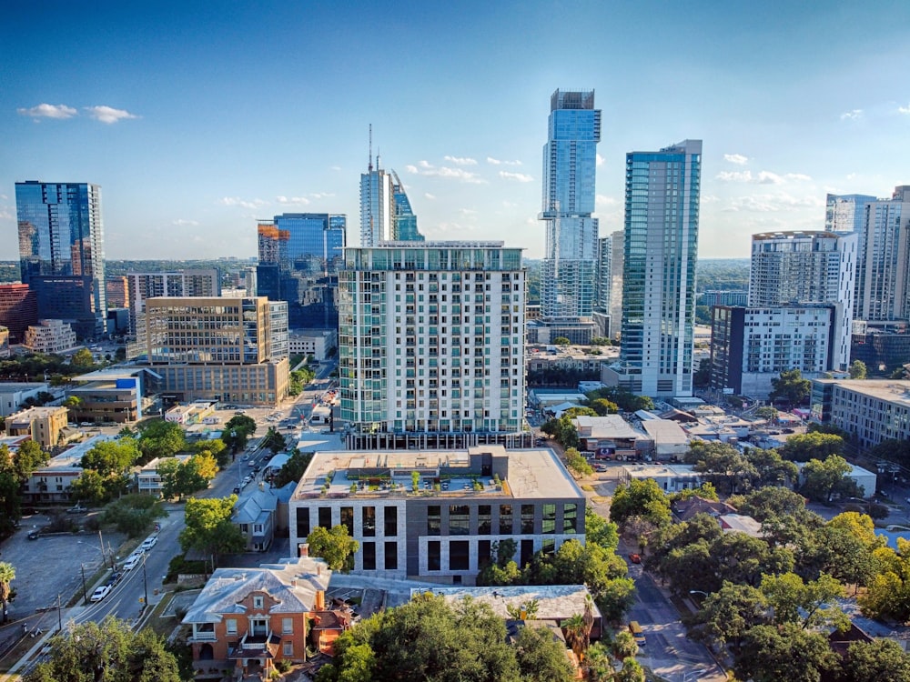 an aerial view of a city with tall buildings