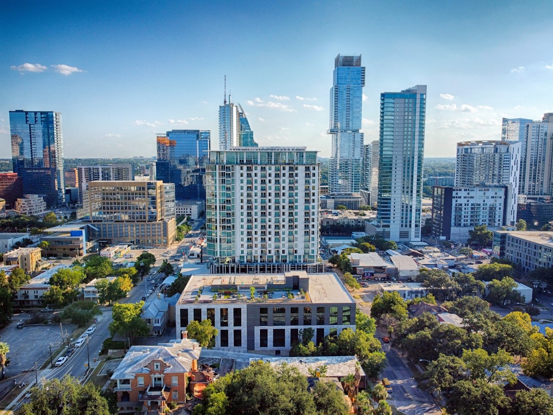 an aerial view of a city with tall buildings,