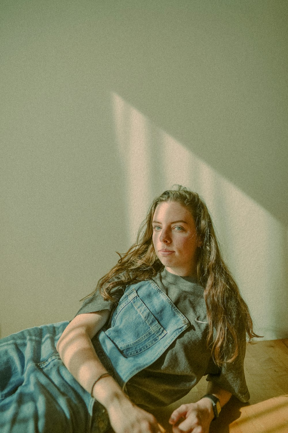 a woman laying on a bed in a room