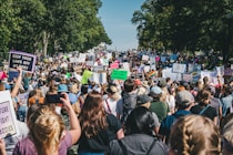 a large group of people holding up signs
