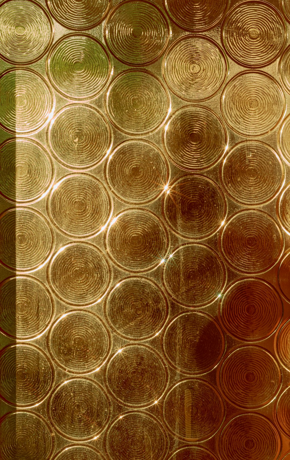 a close up of a window with circles on it