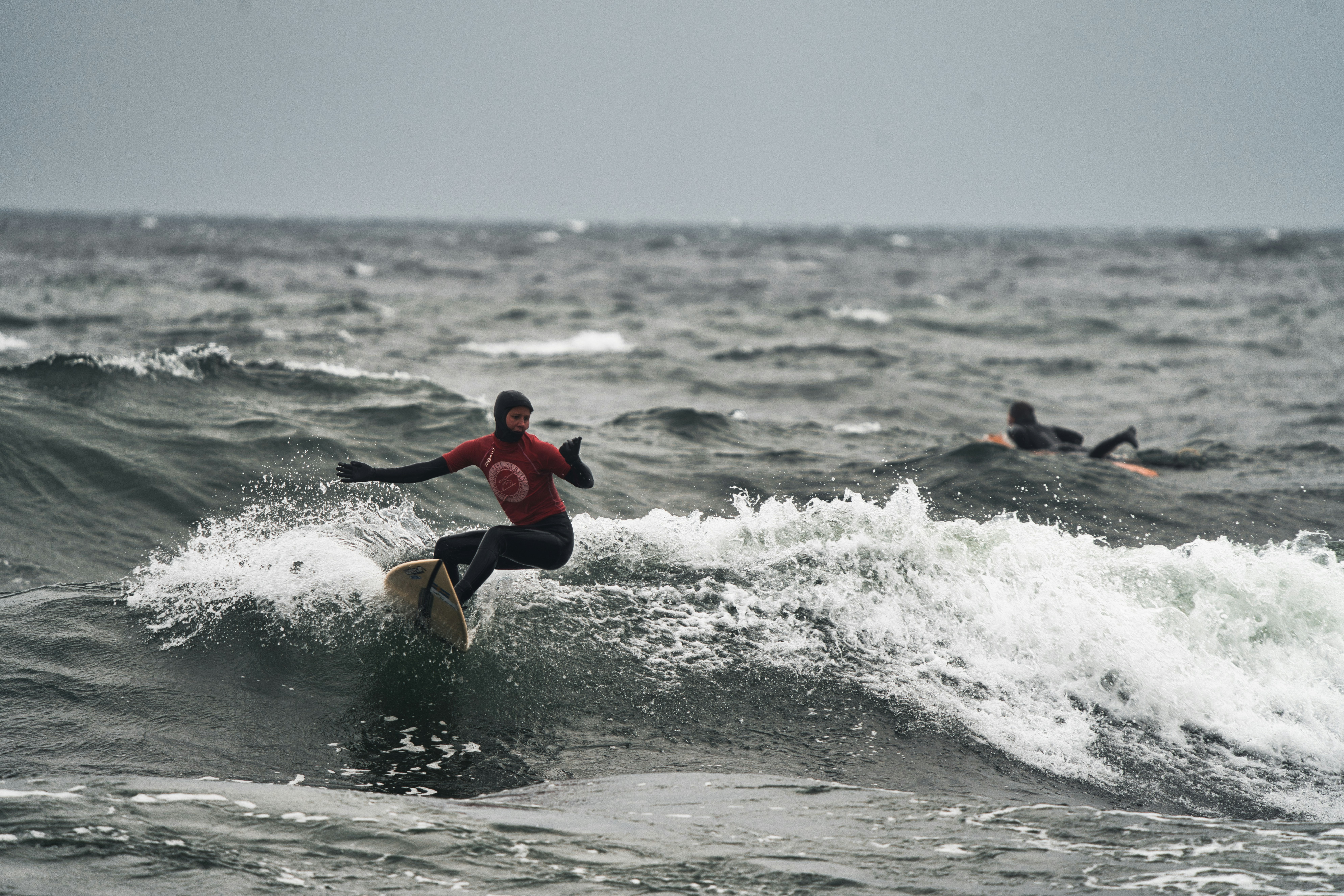 A man riding a wave on top of a surfboard photo – Free Surfing Image on ...