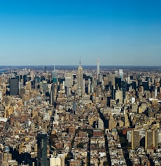 an aerial view of a city with tall buildings