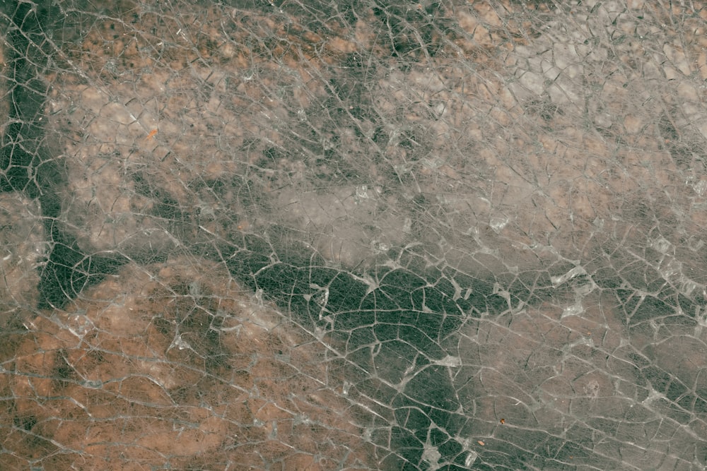 a close up of a brown and white marble