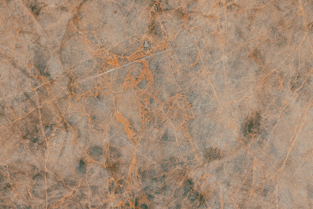 a close up of a brown marble surface