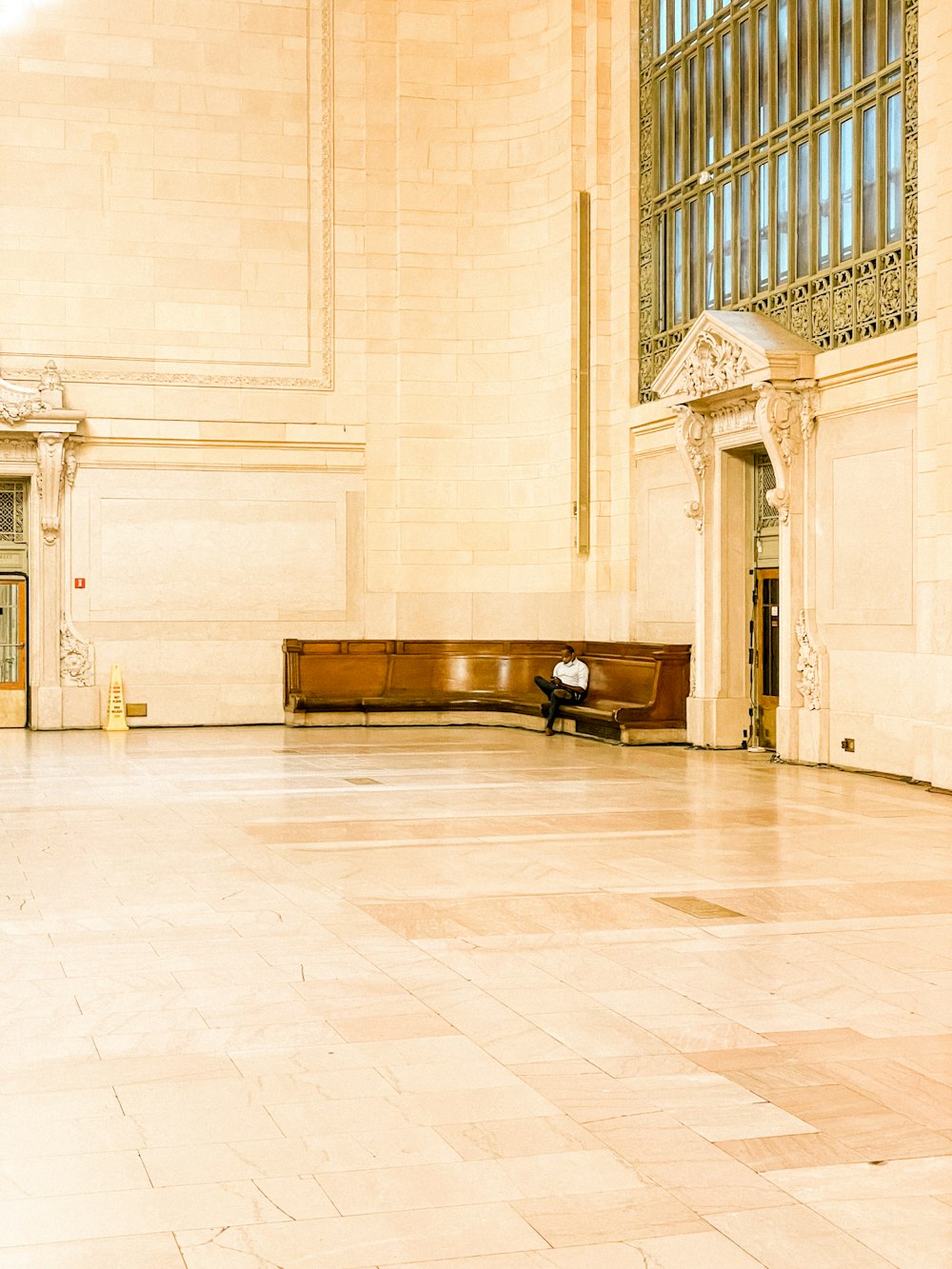 a large room with a wooden bench in it