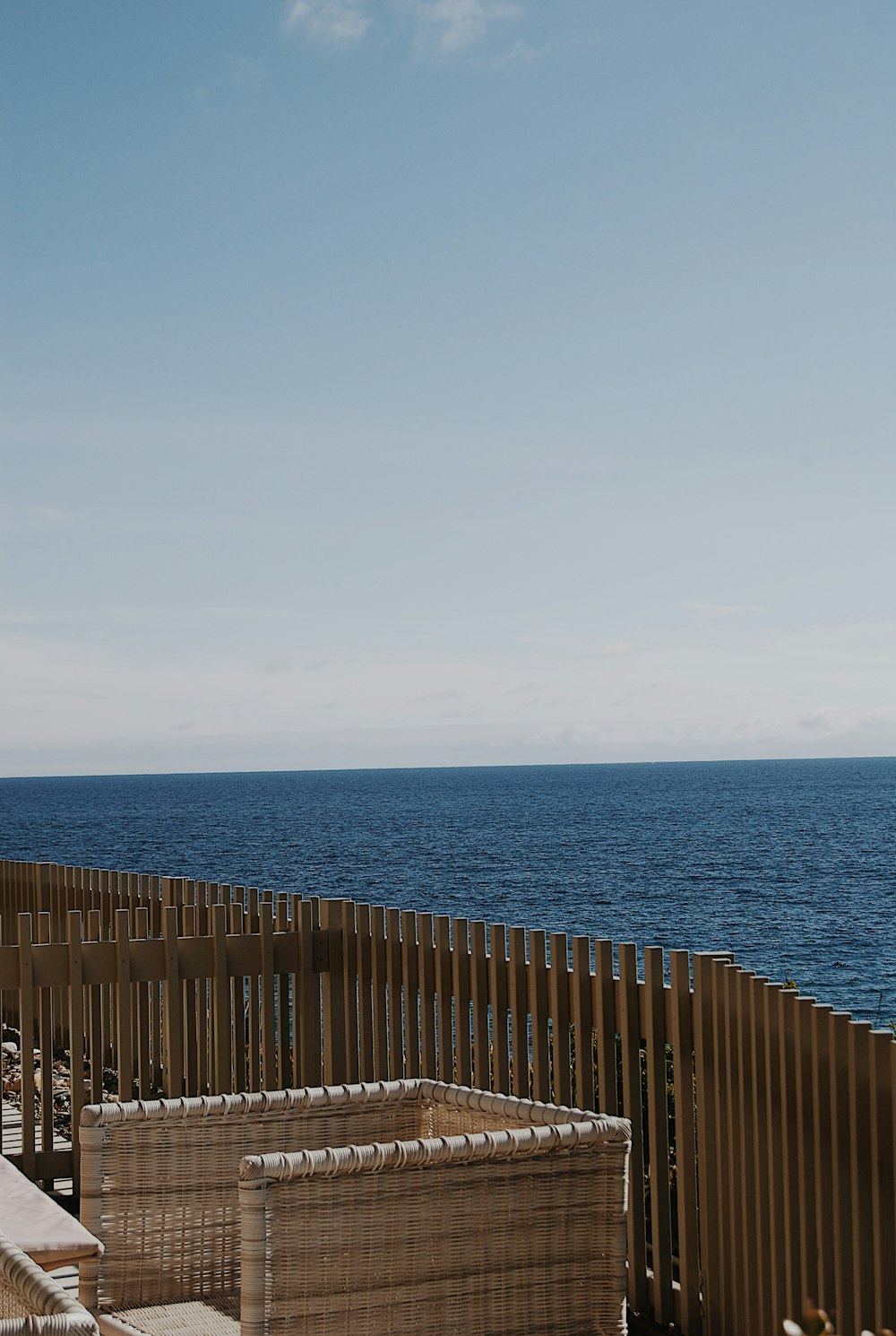 a view of the ocean from a deck