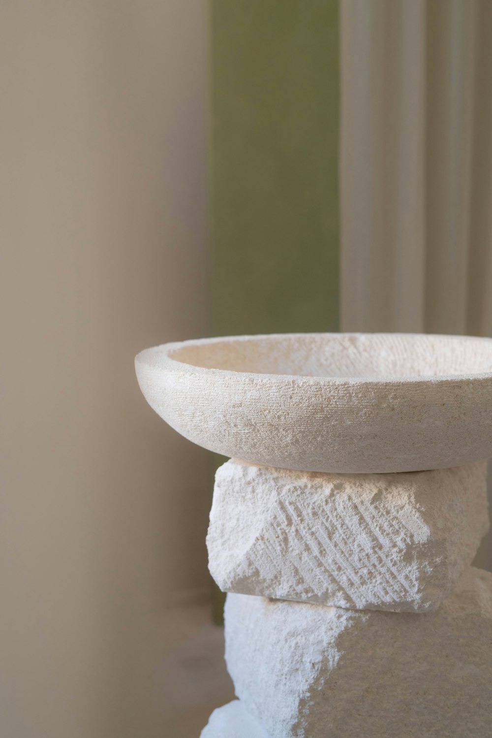 a close up of a white bowl on a table