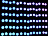 a black background with blue and white circles