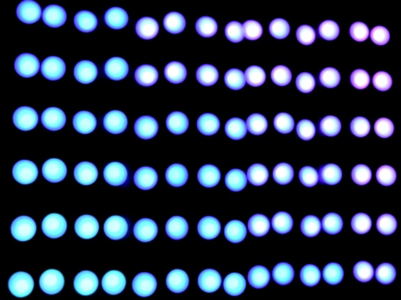 a black background with blue and white circles