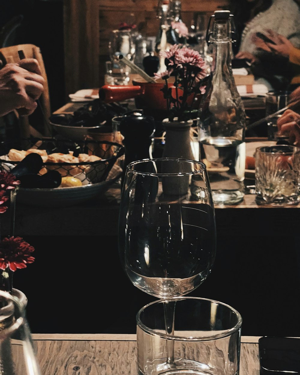 a group of people sitting around a dinner table