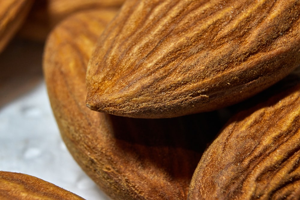 a pile of almonds sitting on top of a table