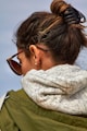 a woman wearing sunglasses and a scarf around her neck