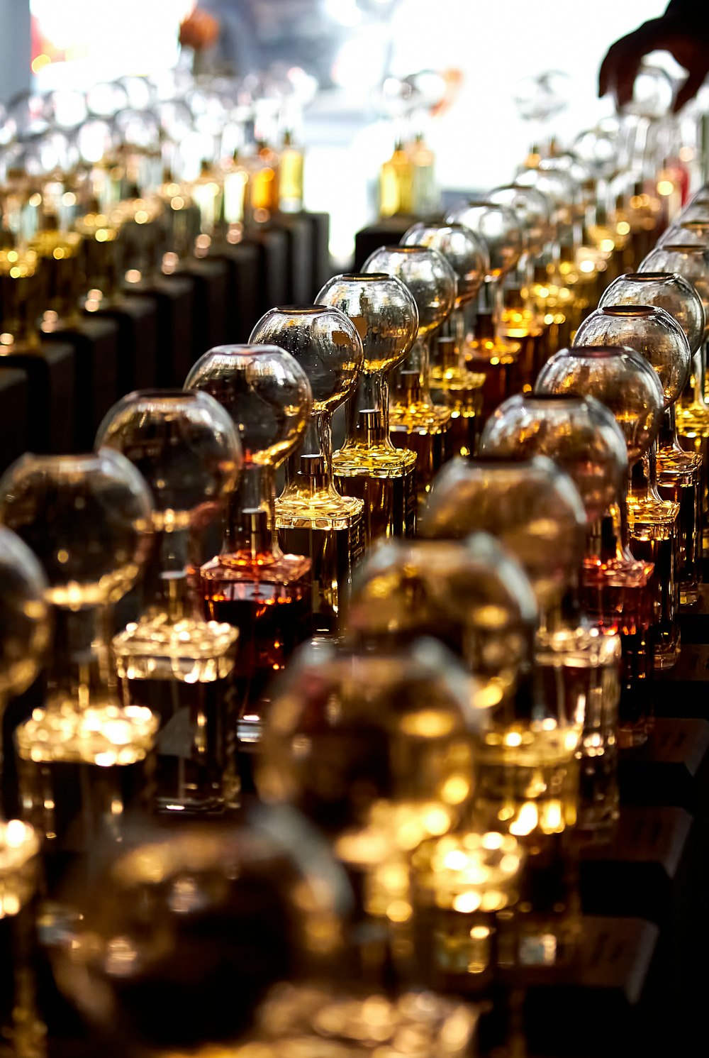 a row of wine glasses sitting next to each other