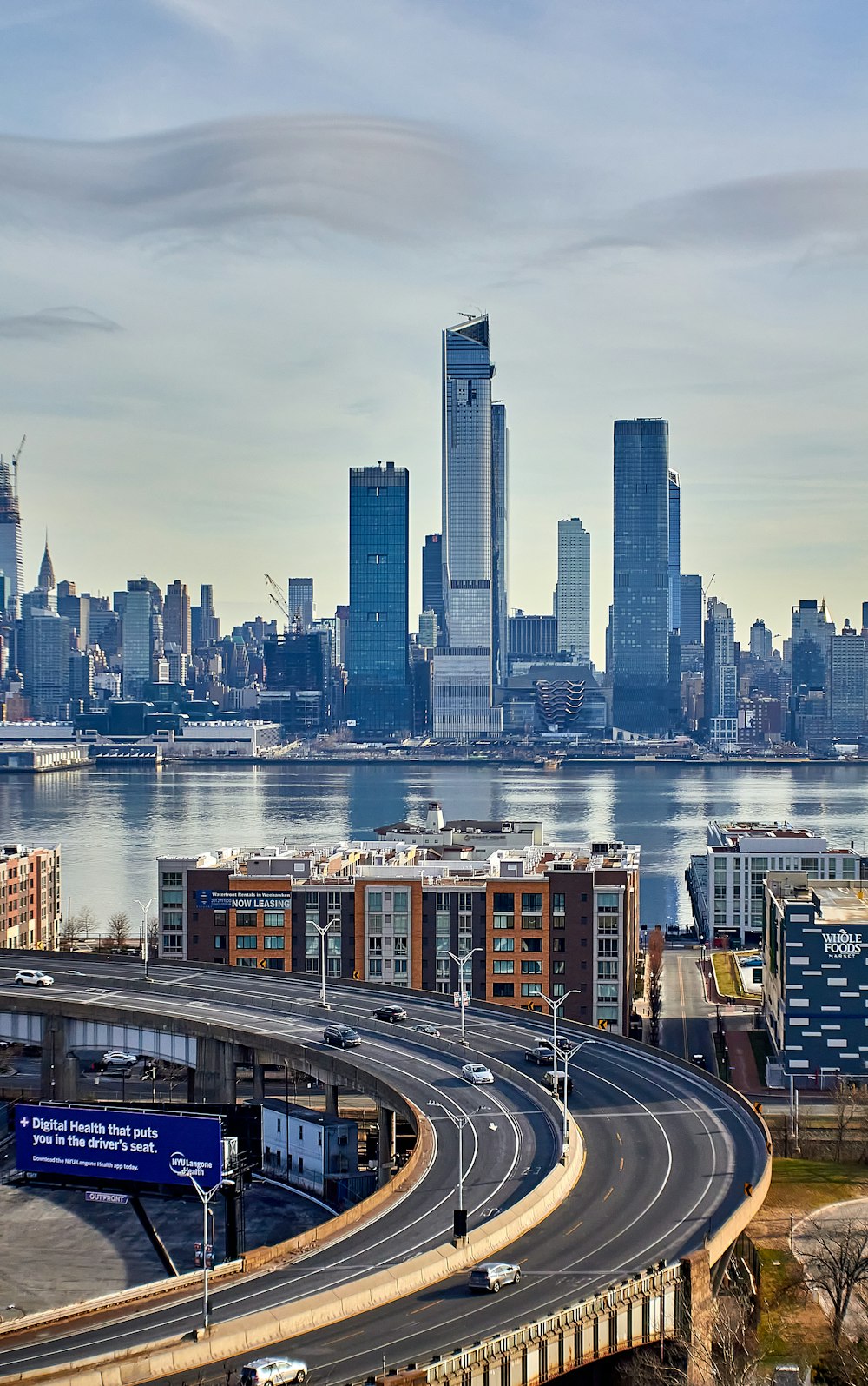 a view of a city skyline with a highway going through it